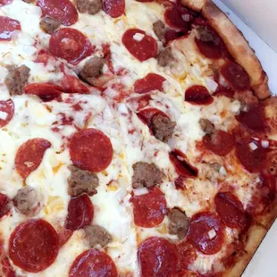Sausage, pepperoni and onion with extra sauce.