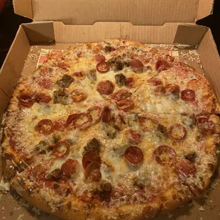 14 inch BYO Pizza with Pepperoni, Sausage and Extra Cheese. The crust was Garlic and Cheese flavored