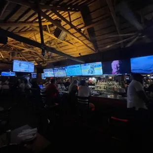 a bar with multiple screens