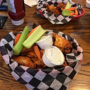 two baskets of food on a table