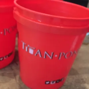 a close up of three red plastic cups