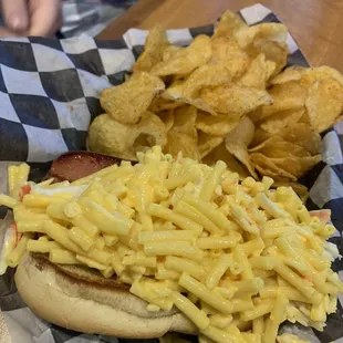 a hot dog with macaroni and cheese