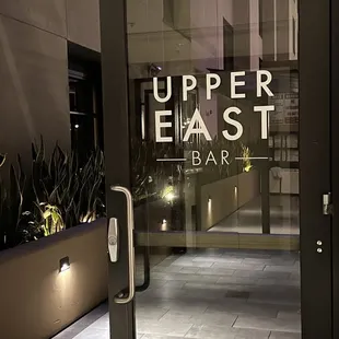 the entrance to upper east bar