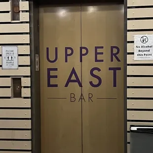 the entrance to upper east bar