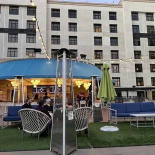 outdoor seating area with tables and umbrellas