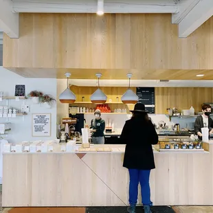 a woman standing at a counter
