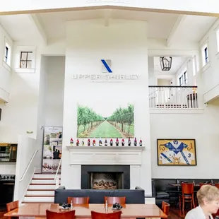 dining room with fireplace and staircase