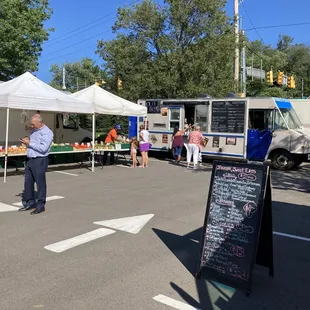 man standing in front of a food truck