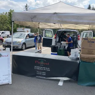 man standing under a tent