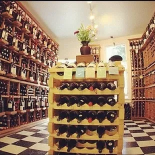 rows of wine bottles in a wine cellar