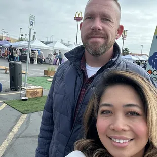 a man and woman taking a selfie