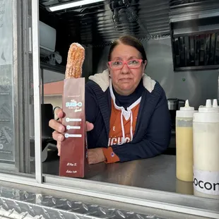 a woman holding a baguet