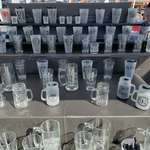 a variety of glasses and mugs
