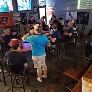 a group of people sitting at a bar