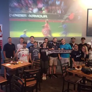 a group of people holding up signs