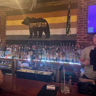 a man standing at the bar