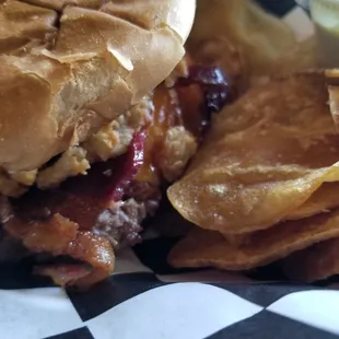 Cowboy burger, cheese, barbq sauce, onion rings, huck of beef....great taste..get plenty of napkins.