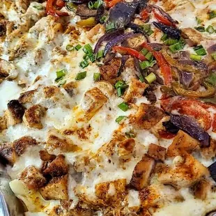 a pizza with meat and vegetables