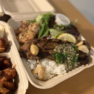 two take out containers of food