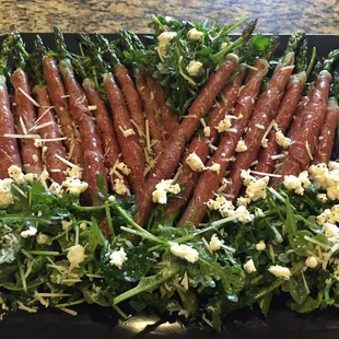 Roasted organic asparagus in prosciutto and feta
