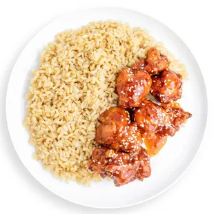 a plate of food with rice and meat