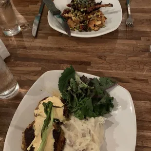 Crab Cakes stuffed w/Mac &amp; Cheese and Asiago Mashed Potatoes. Across from me is the Pork Chop w/succotash.