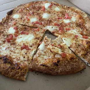 Not a real margarita pizza. Disappointing and bland. Not worth the money