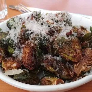 Fried brussel sprouts with a drizzle of acidic and sweet. Perfect preparation.