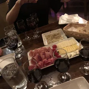 a table of food and wine glasses