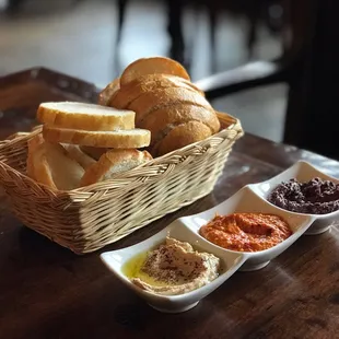 The Trio - Chickpea hummus, almond roasted red pepper romesco, and olive-walnut tapenade.