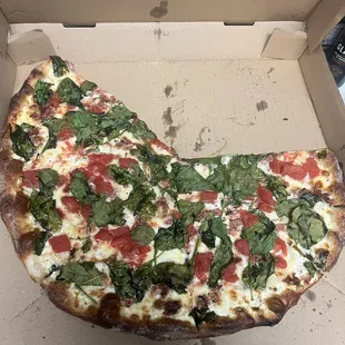 Forgot to take a photo before digging in. White pie with spinach, tomato, and bacon. Incredible!!!