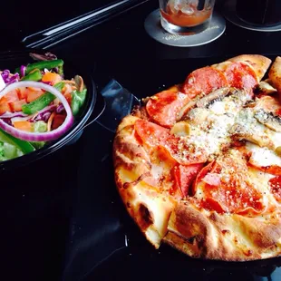 Pizza flatbread with side salad.