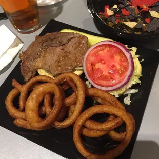 Steak sandwich with onion rings. Wouldn&apos;t order again