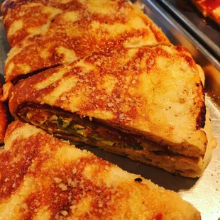 Italian STROMBOLI! Salami,ham, pepperoni, tomatoes, peppers, onions and Dave&apos;s special sauce