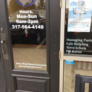 Main door, hours, phone#, owners. Nov. 2021.
