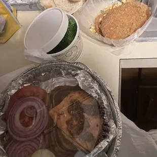 Lunch menu salmon sandwich and broccoli  Fried green tomatoes  Bread for the table (so fresh)