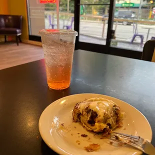 a plate of food and a drink on a table