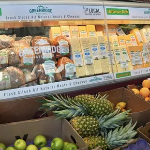 Fresh fruits and veggies alongside our deli counter, where you can get deli cuts and yummy sandwiches!