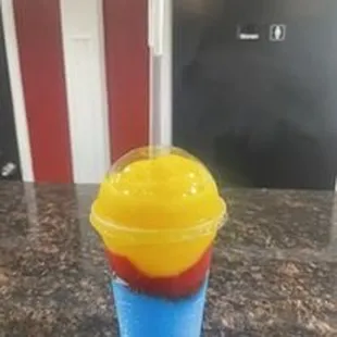 a cup of ice cream with a straw