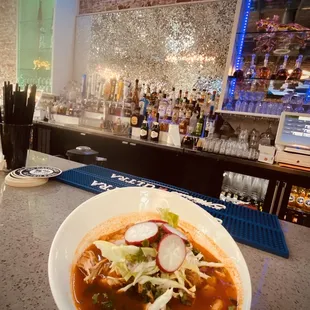 a bowl of soup on the bar