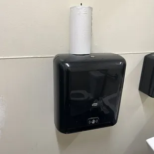 Wet paper towel roll on top of holder