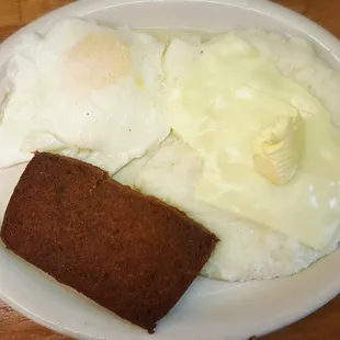 Over easy eggs, pork scrapple, and grits with cheese! So good!