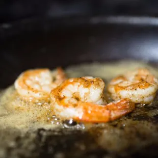 shrimp frying in a skillet