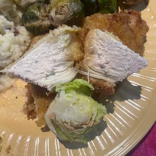 Dry Chicken Scollopini and Uncooked/Raw Roasted Brussel Sprouts.