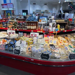 a display of cheeses and other foods