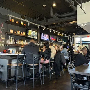 people sitting at the bar