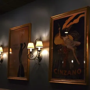 a row of framed posters on the wall