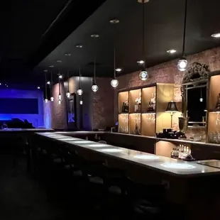 a dimly lit bar area