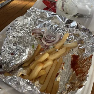 Gyro sandwich eaten &amp; a few French Fries left