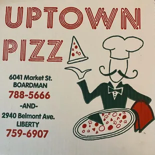 a pizza box with a man holding a slice of pizza